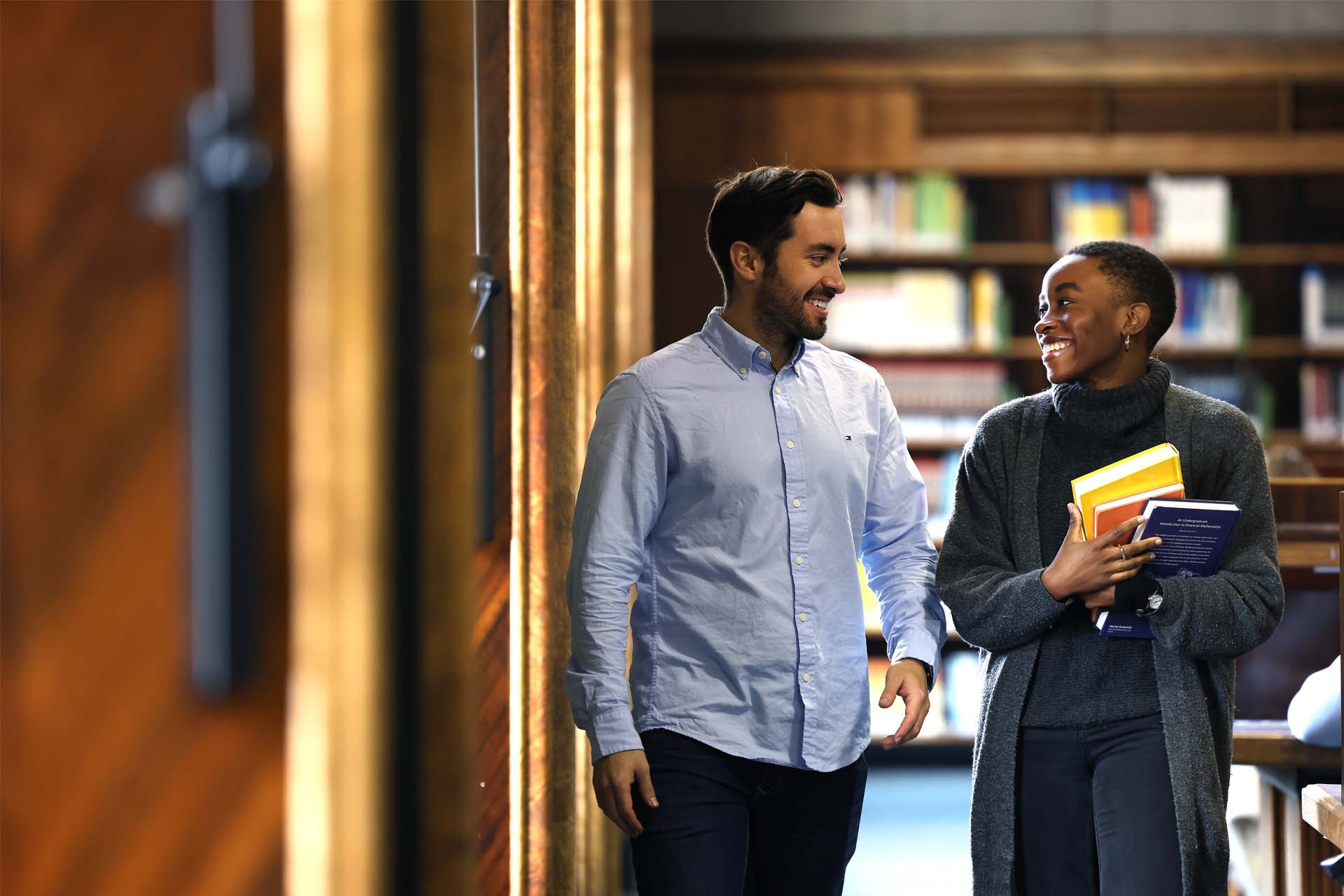 Two postgraduate students in the Harold Cohen Library.