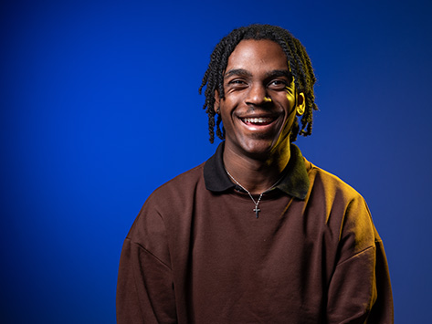 Image of a black male student smiling