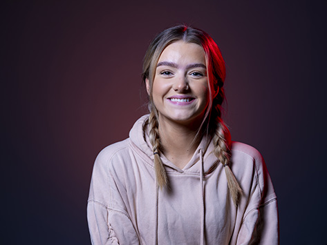 Image of a white female student smiling