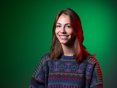 Image of a female student with brown hair smiling