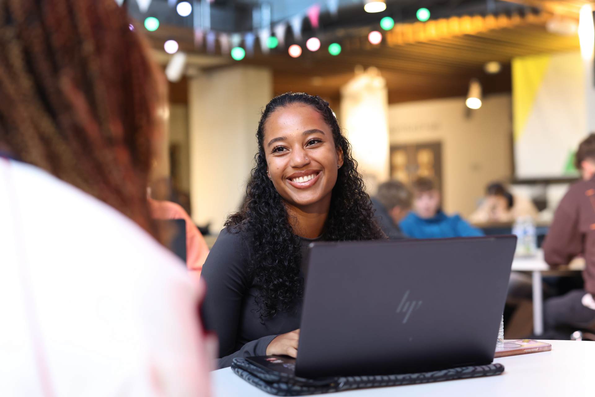 A student using a laptop in the Guild.