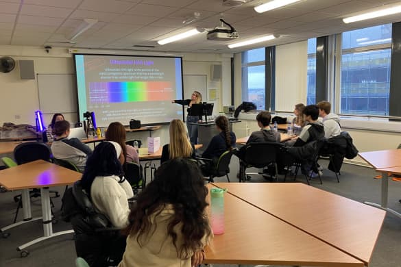 Students listening to a talk from a cancer researcher