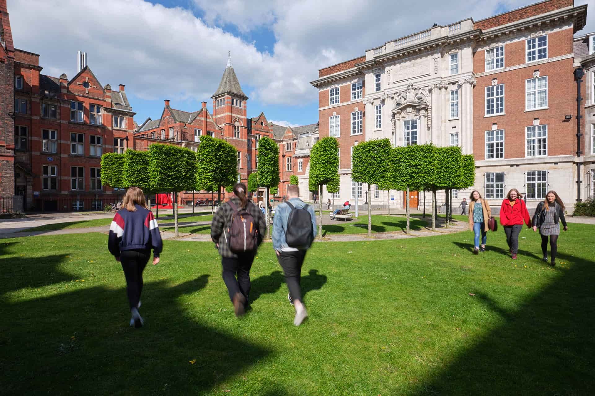 Students walking through the quadrangle on campus at Liverpool