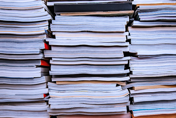 Close up image of a stack of old journals